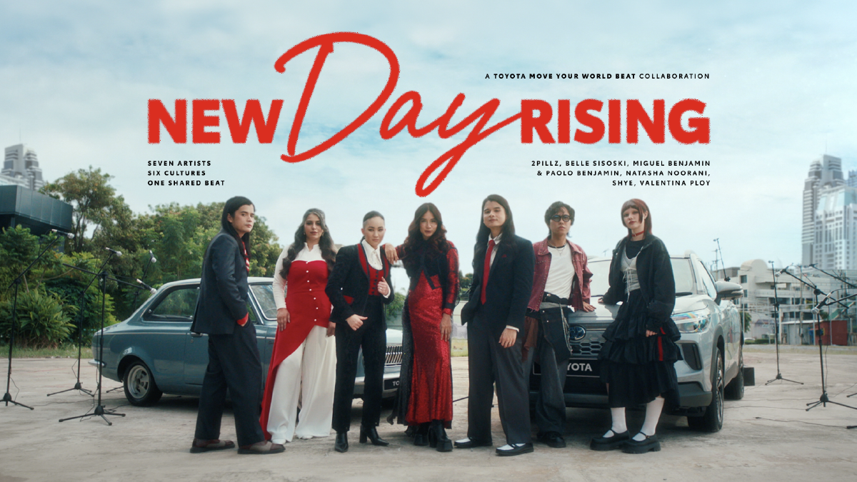 ‘New Day Rising’ music video: the seven artists standing in front of two Toyota cars