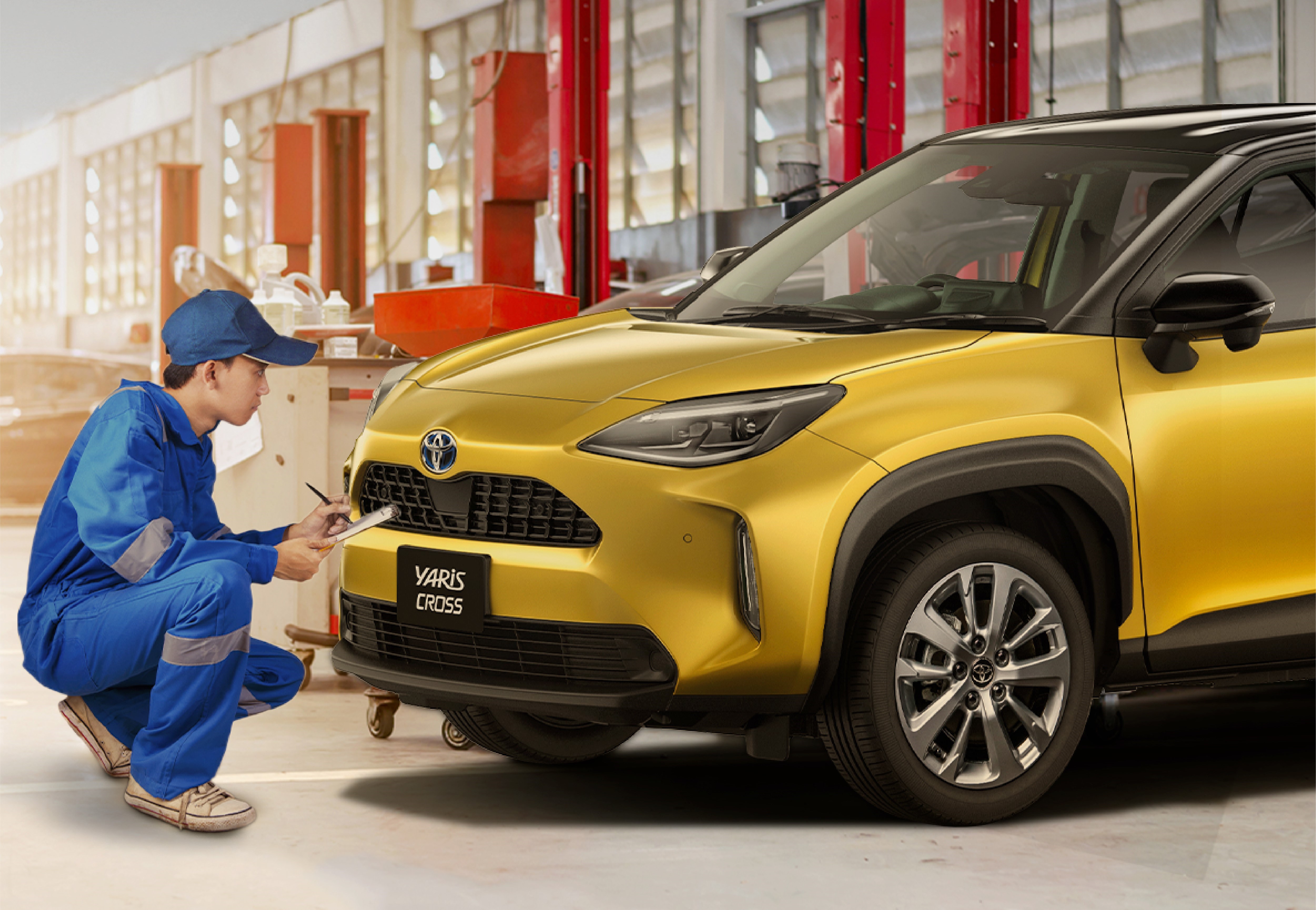 man looking at car for servicing